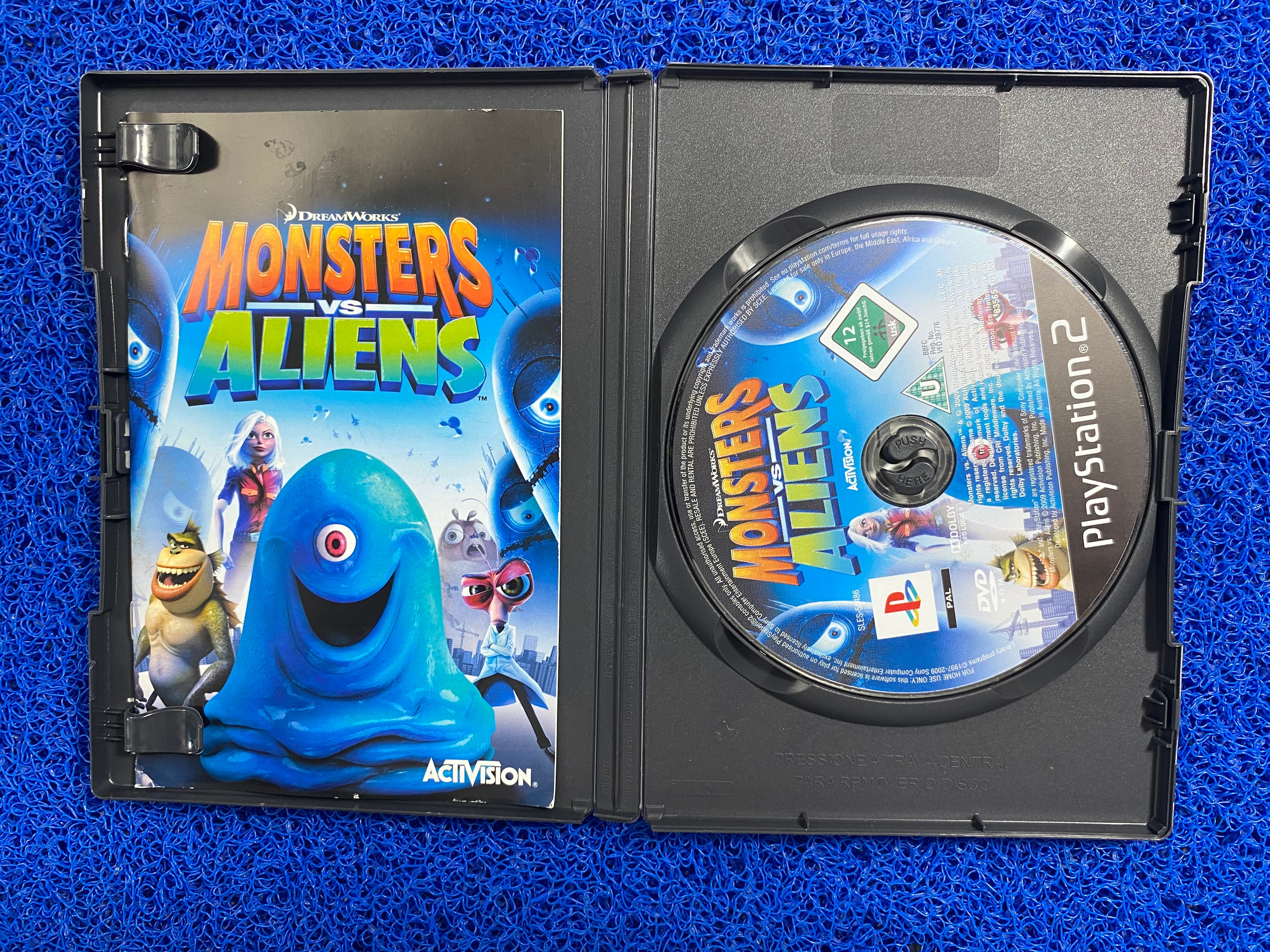 PS2# Monster vs. aliens (E)